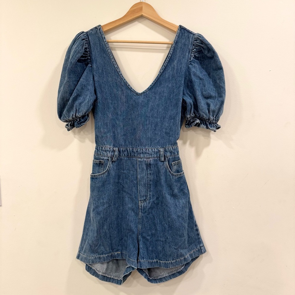 Sophie The Label denim romper with bow tie back detail.